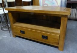 AN OAK CORNER TELEVISION STAND WITH OPEN COMPARTMENT AND ONE LONG DRAWER BELOW