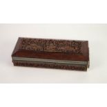 EARLY TWENTIETH CENTURY INDIAN CARVED HARDWOOD AND IVORY INLAID OBLONG BOX, the hinge top with