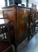 A REPRODUCTION DARKWOOD CUPBOARD  OF ORIENTAL STYLE, HAVING TWO CUPBOARD DOORS ABOVE A LONG DRAWER