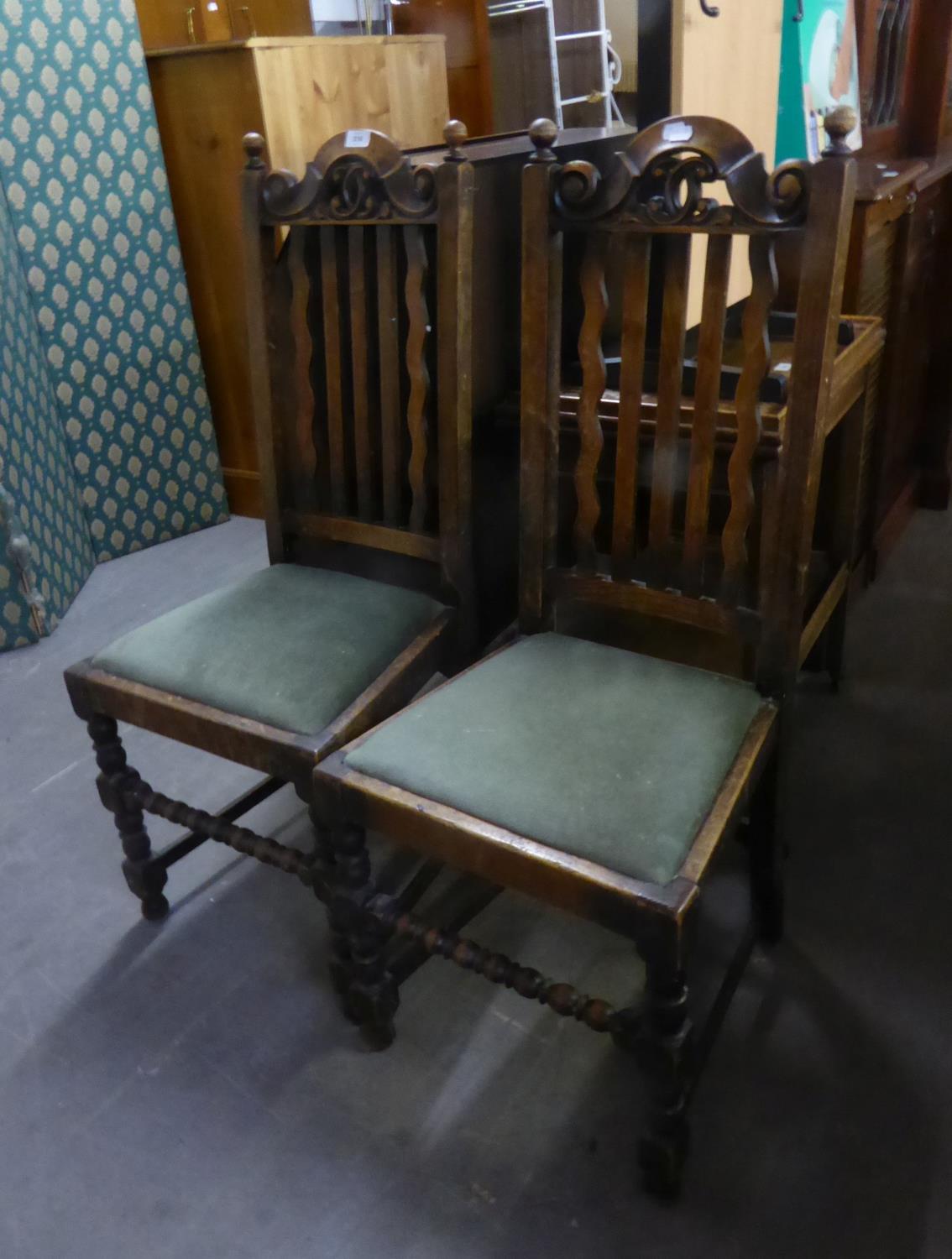 A PAIR OF OAK RAIL BACK DINING CHAIRS, OF JACOBEAN STYLE