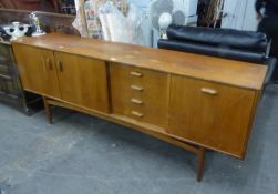 G-PLAN TEAK SIDEBOARD, HAVING TWO CUPBOARD DOORS, FOUR DRAWERS AND DRINKS SECTION WITH SHAPED