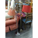 A LATE 20TH CENTURY CHROMIUM PLATED HEIGHT ADJUSTABLE FLOOR STANDING ELECTRIC LAMP, ON CIRCULAR