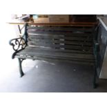 A CAST IRON AND SLATTED WOOD GARDEN BENCH