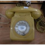 A YELLOW ROTARY DIAL TELEPHONE RECEIVER