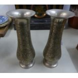 A PAIR OF WHITE METAL VASES