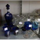 MID TWENTIETH CENTURY BLUE GLASS LIQUEUR DECANTER AND STOPPER AND SIX MATCHING TOTS, WITH PAINTED