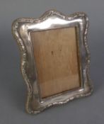 AN EDWARDIAN SILVER FACED PHOTOGRAPH FRAME, wooden backed and easel support, Birmingham 1908