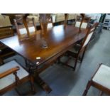 AN ELIZABETHAN STYLE CARVED OAK REFECTORY DINING TABLE, ON TWO END CUP AND COVER STANDARD AND SLEDGE