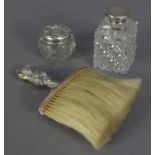 EDWARD VII CRUMB BRUSH WITH EMBOSSED FILLED SILVER HANDLE, together with TWO TOILET JARS WITH SILVER