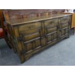 JACOBEAN STYLE OAK DRESSER, WITH THREE SHORT DRAWERS, OVER THREE DOORS WITH COFFERED FRONT, 5?5?