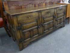 JACOBEAN STYLE OAK DRESSER, WITH THREE SHORT DRAWERS, OVER THREE DOORS WITH COFFERED FRONT, 5?5?