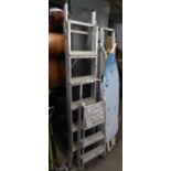 A METAL FOLDING LADDER/STEP LADDER; METAL FOUR TIER PLATFORM STEPS AND THREE TIER PLATFORM STEPS AND
