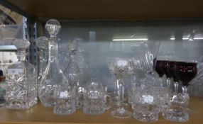 FOUR MODERN CUT GLASS DECANTERS AND STOPPERS, including one initialled J, together with a SMALL