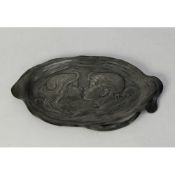 UNMARKED ART NOUVEAU EMBOSSED PEWTER SHALLOW DISH, of shaped oval form, the centre embossed with the