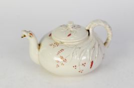 D.M. McBIRNEY & CO., BELLEEK, IRISH WHITE PORCELAIN SQUAT CIRCULAR TEAPOT, foliate embossed, the lid