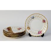 SET OF FIVE BERLIN 19th CENTURY PORCELAIN DESSERT PLATES, each spirally embossed sides with osier