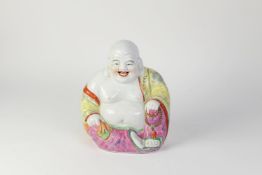 20th CENTURY CHINESE PORCELAIN PU-TAI FIGURE, seated with corpulent body and laughing face,