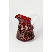 NINETEENTH CENTURY RUBY STAINED AND FLASH CUT GLASS JUG, of tapering form with clear glass scroll