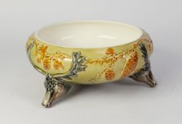 LATE NINETEENTH CENTURY WEDGWOOD MOULDED POTTERY FRUIT BOWL, of bellied form with three stags head