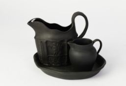 WEDGWOOD BLACK BASALT POTTERY CREAM JUG, of ovoid form with scroll handle, 2 ½? (6.4cm) high,