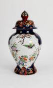 MODERN ORIENTAL PORCELAIN VASE AND COVER, of ovoid form with pointed finial to the domed cover,