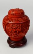 MODERN ORIENTAL CARVED CINNABAR LACQUER JAR AND COVER, of ovoid form with domed cover, decorated