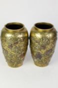 PAIR OF ORIENTAL BRASS VASES, each of ovoid form applied in pewter and tinned copper with designs of