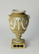 20th CENTURY WEDGWOOD GOOD, LIGHT BROWN AND WHITE JASPER WARE URN SHAPED VASE, bolted on to a yellow