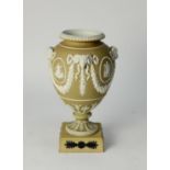 20th CENTURY WEDGWOOD GOOD, LIGHT BROWN AND WHITE JASPER WARE URN SHAPED VASE, bolted on to a yellow