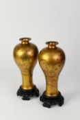 PAIR OF CHINESE QING DYNASTY GOLD LACQUER INVERTED BALUSTER SHAPE VASES, with narrow waisted necks