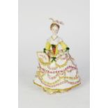 PROBABLY 19th CENTURY PARIS PORCELAIN REGENCY FIGURE OF A LADY, in a décolleté crinoline dress,