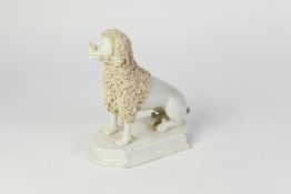 WELL MODELLED NINETEENTH CENTURY STAFFORDSHIRE PEARLWARE POTTERY MODEL OF A POODLE