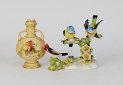 ROYAL DOULTON CHINA GROUP BLUE TIT, two birds on a tree stump, floral encrusted base, 4 1/4in (11cm)