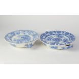 TWO NINETEENTH CENTURY SPODE BLUE AND WHITE POTTERY WARMING PLATES, one in ?THE FOX AND THE LION,