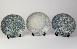 THREE AGED CHINESE BINH THUAN SHIPWRECK SHALLOW BLUE AND WHITE DISHES, each labelled and numbered