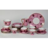 VIENNA 19th CENTURY PORCELAIN TEA SERVICE, pink with gilt radiating bands and borders, the three