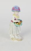 MEISSEN 19th CENTURY PORCELAIN FRUIT PICKER GIRL, with an apron full of fruit, barefoot, on the