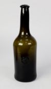 ANTIQUE DARK GREEN BLOWN GLASS WINE BOTTLE WITH A CROWNED P APPLIED SEAL, 11 ½? (29.2cm) high