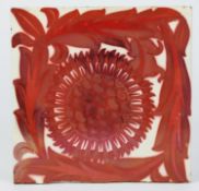 WILLIAM DE MORGAN STYLE RED LUSTRE GLAZED POTTERY TILE, decorate with a sunflower head, enclosed by