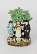 EARLY 19th CENTURY STAFFORDSHIRE POTTERY TITHE PIG GROUP OF THREE FIGURES, a vicar, a man and his