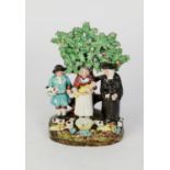 EARLY 19th CENTURY STAFFORDSHIRE POTTERY TITHE PIG GROUP OF THREE FIGURES, a vicar, a man and his