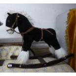 A SMALL CHILD'S ROCKING HORSE, STUFFED HORSE ON WOODEN BASE