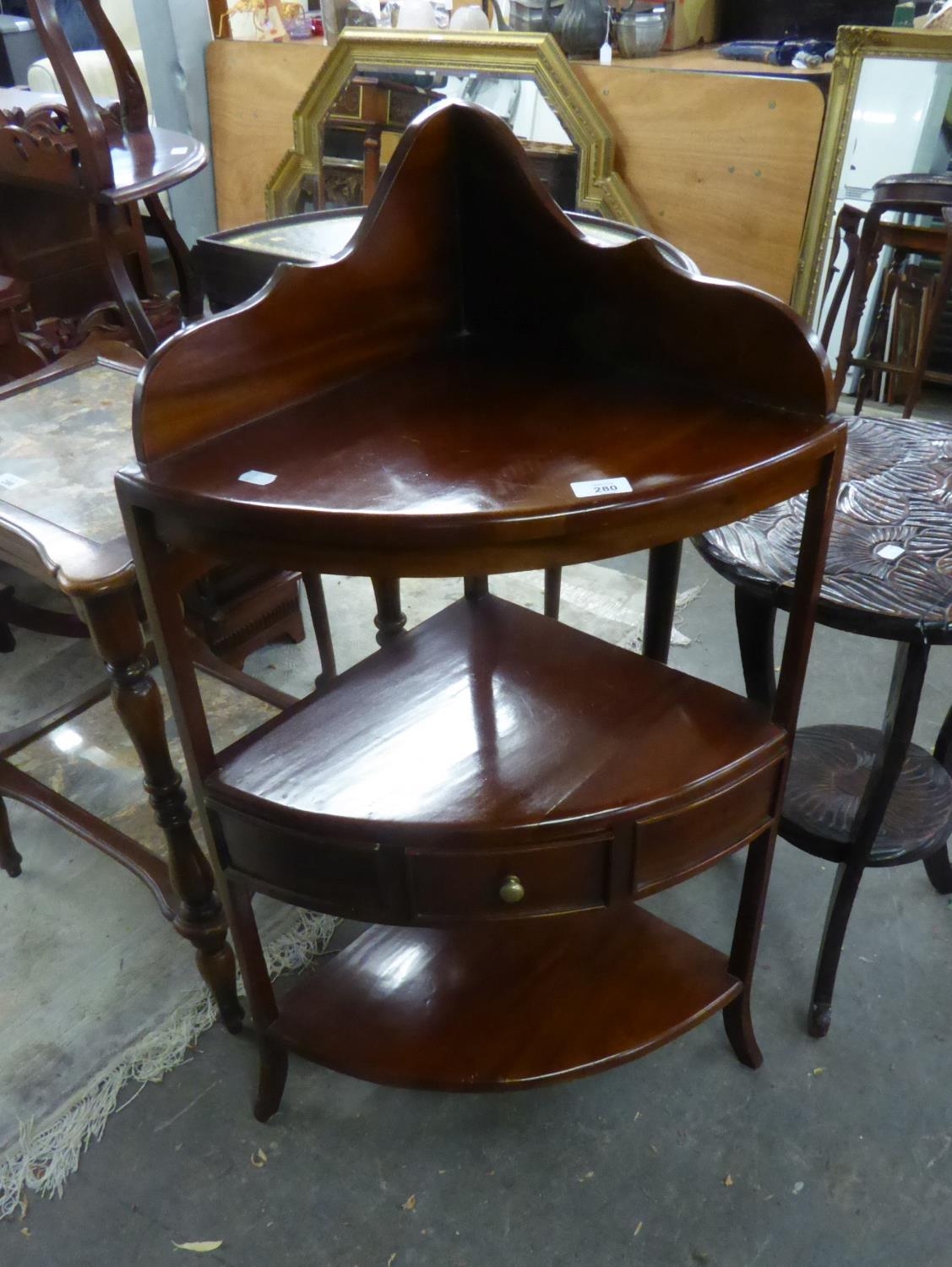 A MAHOGANY GEORGIAN STYLE THREE TIER CORNER WASHSTAND, WITH A SMALL DRAWER