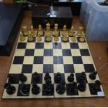 A STAUNTON PAINTED PATTERN CHESS SET AND BOARD, CONTAINED IN A MAHOGANY BOX
