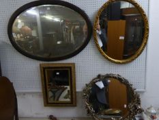 A LARGE OVAL MAHOGANY FRAMED MIRROR, TWO OVAL GILT FRAMED MIRRORS AND A SMALL OBLONG GILT FRAMED