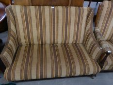 A LATE VICTORIAN SEMI-WINGED SMALL DRAWING ROOM SETTEE, COVERED IN STRIPED FABRIC