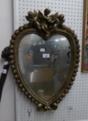 A HEART SHAPED SMALL WALL MIRROR, IN HEART SHAPED FRAME