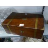 AN ANTIQUE MAHOGANY AND BRASS BOUND WRITING BOX, WITH ENCLOSED LEATHER WRITING SLOPE, WITH KEY