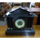 ARCHITECTURAL STYLE BLACK SLATE MANTEL CLOCK, WITH MOVEMENT STRIKING ON A COILED GONG