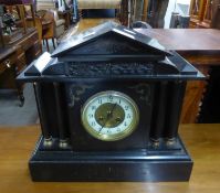 ARCHITECTURAL STYLE BLACK SLATE MANTEL CLOCK, WITH MOVEMENT STRIKING ON A COILED GONG